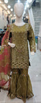 Ladies green kameez and Gharara with intricate hand embellishments