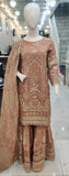 Ladies peach kameez and Gharara with intricate hand embellishments