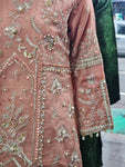 Ladies peach kameez and Gharara with intricate hand embellishments