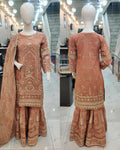 Ladies peach kameez and Gharara with intricate hand embellishments