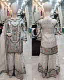 Ladies White kameez and Gharara with intricate hand embellishments