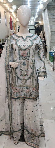 Ladies White kameez and Gharara with intricate hand embellishments