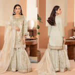 Ladies light green kameez and Gharara with intricate hand embellishments