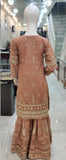 Ladies peach kameez and Gharara with intricate hand embellishments